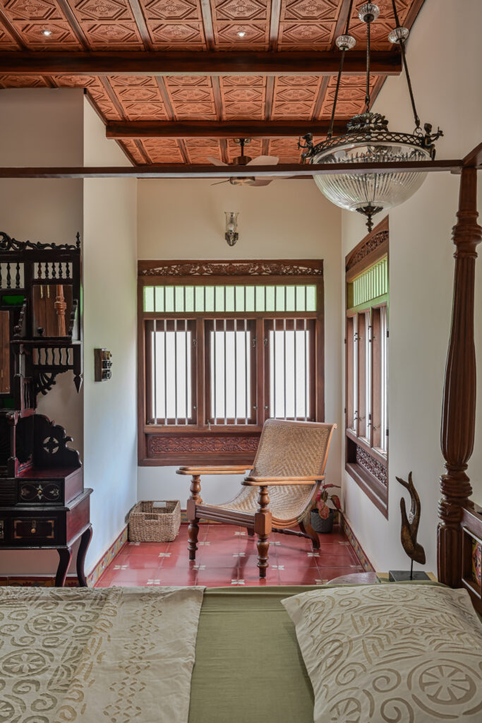 Raja’s Cottage - A traditional Mangalore home with a Chettinad Flavour | arm chair and corner window in master bedroom