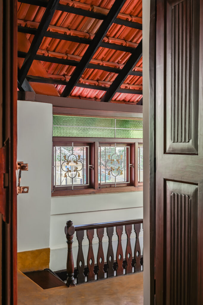 Raja’s Cottage - A traditional Mangalore home with a Chettinad Flavour | staircase wooden carved detail