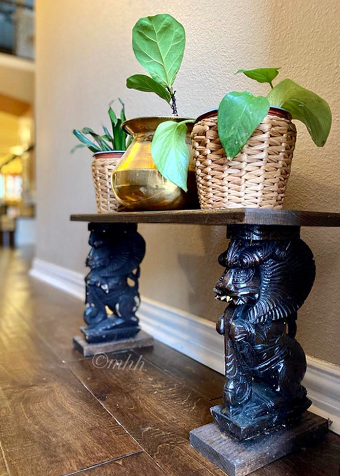 Home tour of Meena Harish | A traditional brass cooking pot as a planter on the Yazhi holding up a plant bench