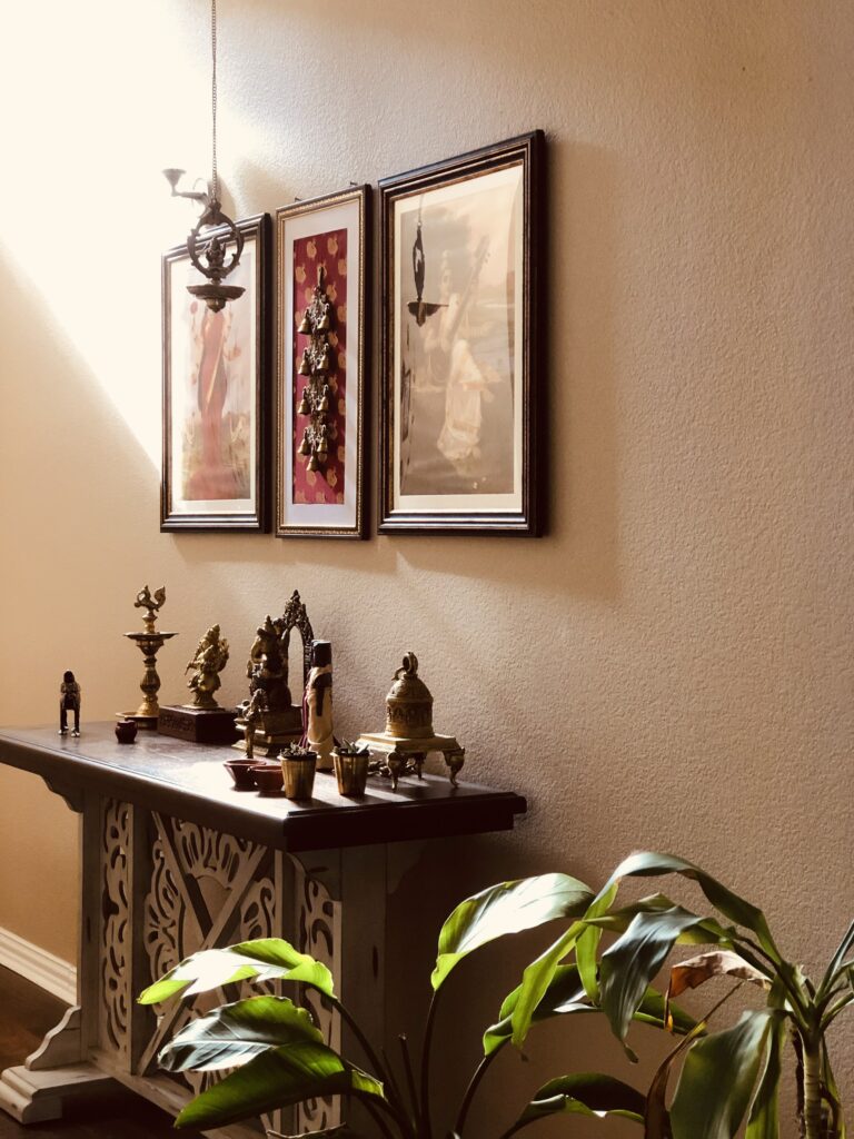 Home tour of Meena Harish | The foyer elegant with a beautiful console and arty frames against a pastel wall