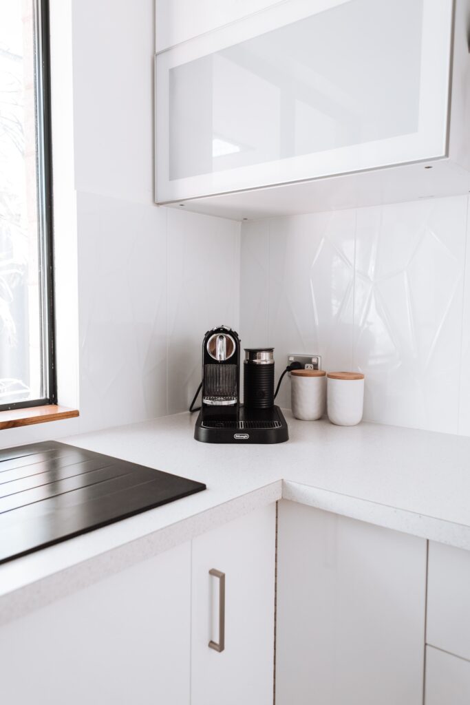 White kitchen cabinet near the window | Aluminium or uPVC Windows