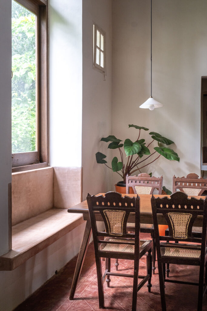 The dining room with green plant and window view | Heritage home in Parra