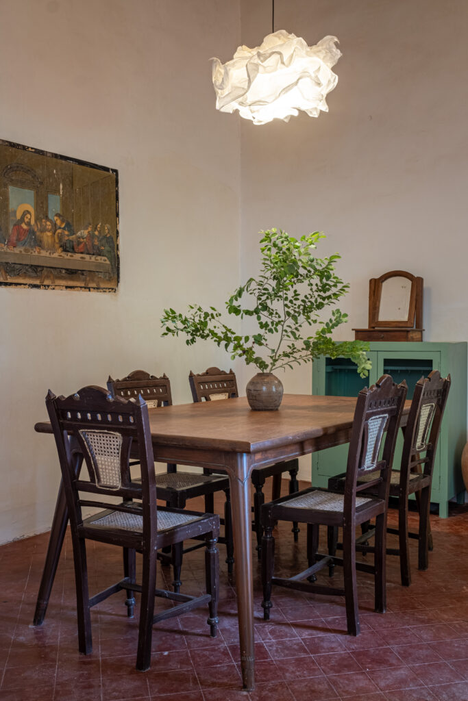 The dining table, the side board and the Last Supper picture on the wall | Heritage home in Parra