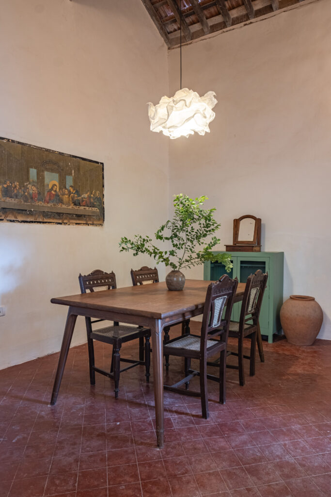 The dining table, the side board and the Last Supper picture on the wall | Heritage home in Parra