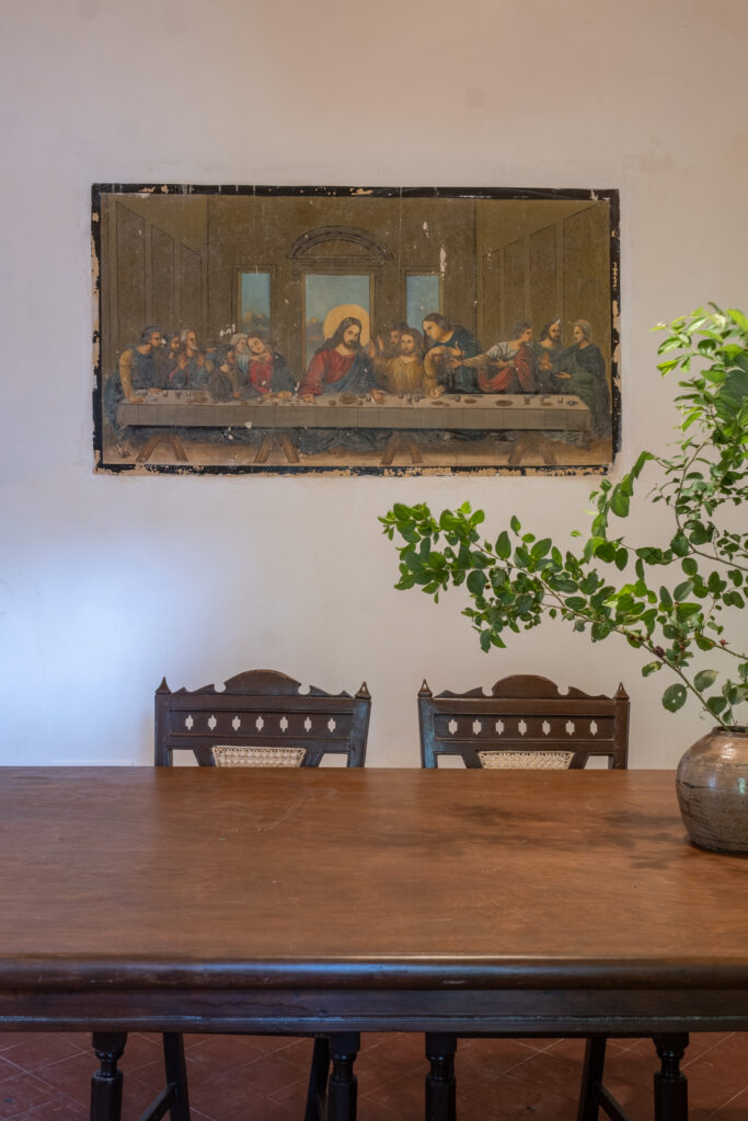 The dining table and the Last Supper picture on the wall | Heritage home in Parra