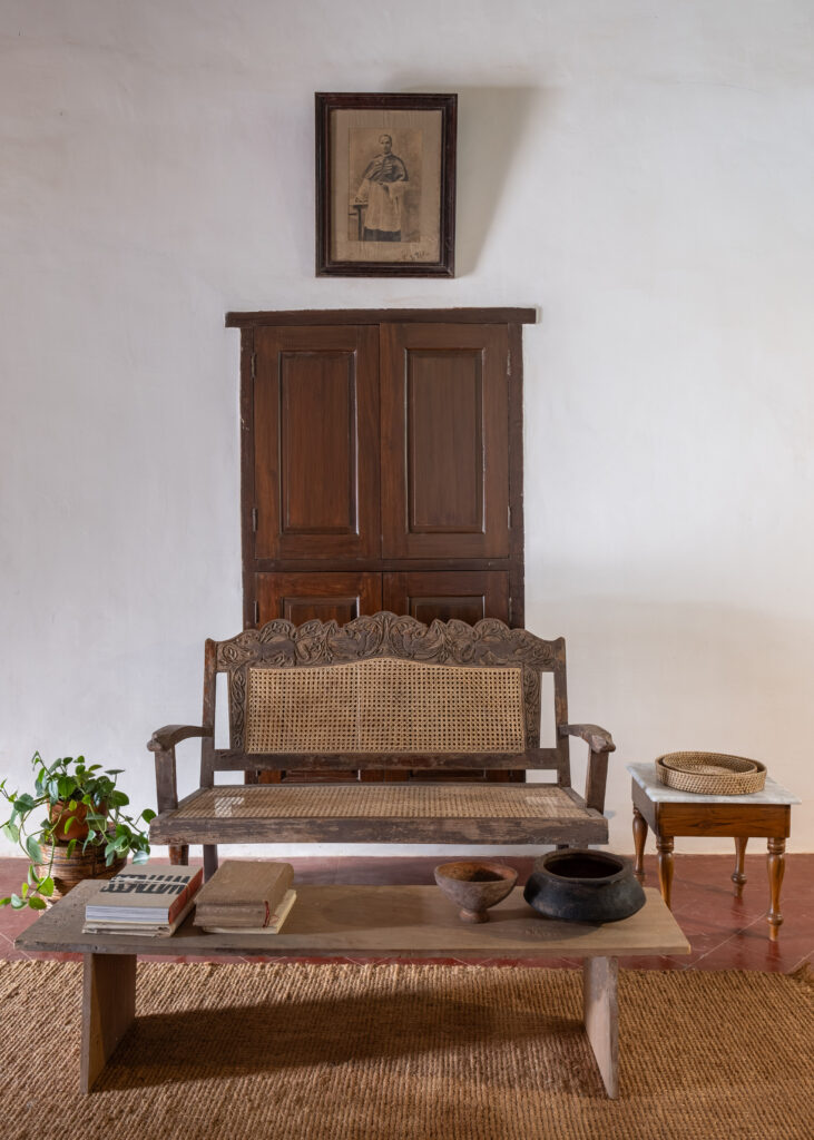 Wall cupboards, antique furniture and old photo on the wall |