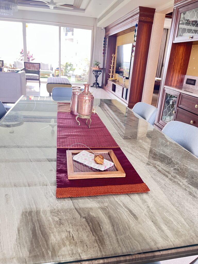 Traditional copper water dispenser at the dining table | Ranjana and Milind's apartment in Pune