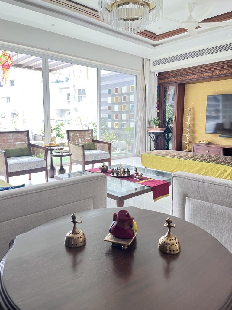 The happy fusion of brass, wood and fabric in the living room decor | Ranjana and Milind's apartment in Pune