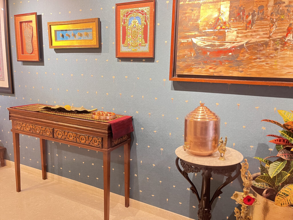 The Vishnu padham and the mudras in the entryway gallery wall | Ranjana and Milind's apartment in Pune