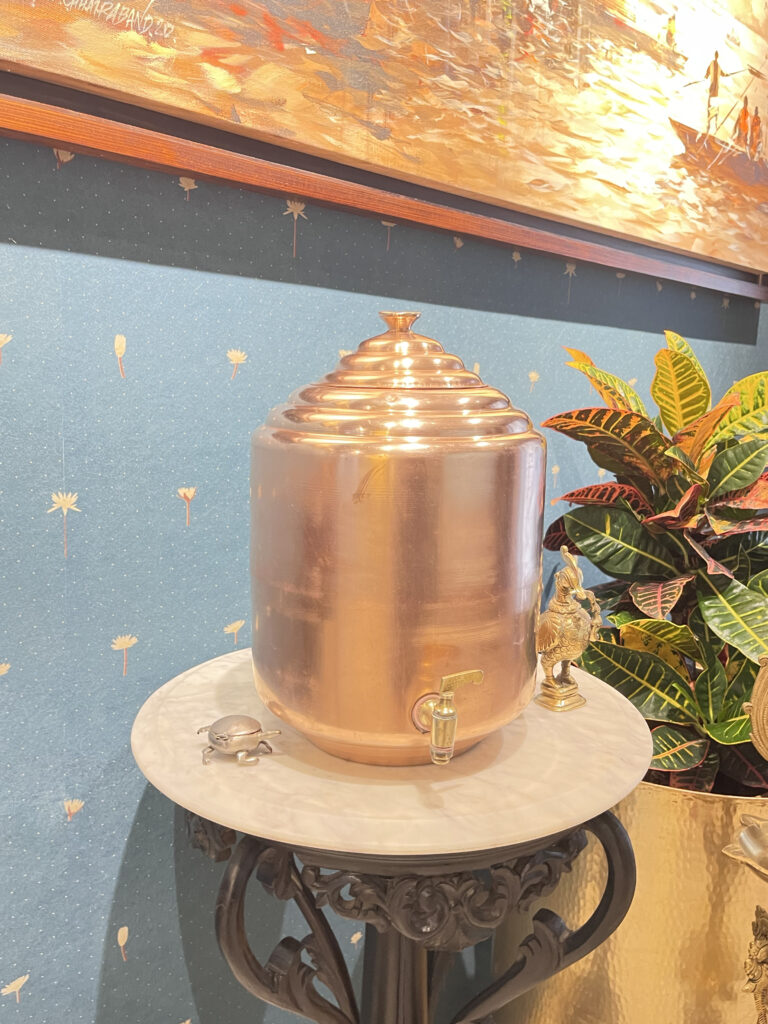 Traditional copper water dispensers in the entrance foyer | Ranjana and Milind's apartment in Pune