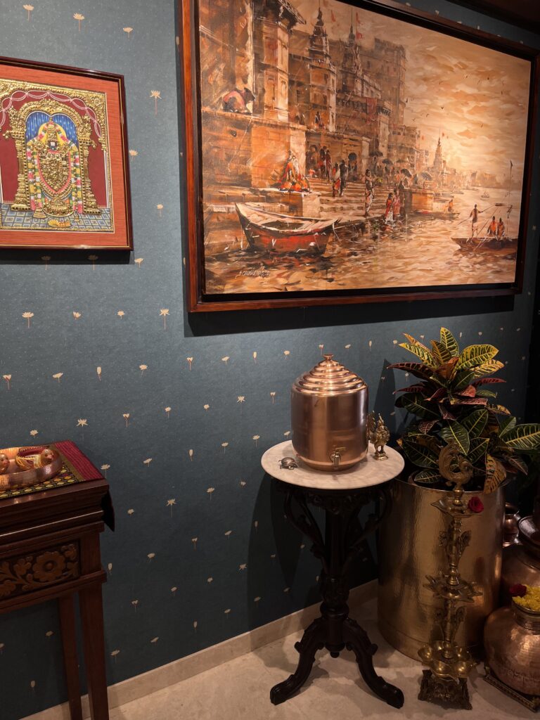 Vintage water dispensers, large vessels and mudras frame in the entrance foyer | Ranjana and Milind's apartment in Pune