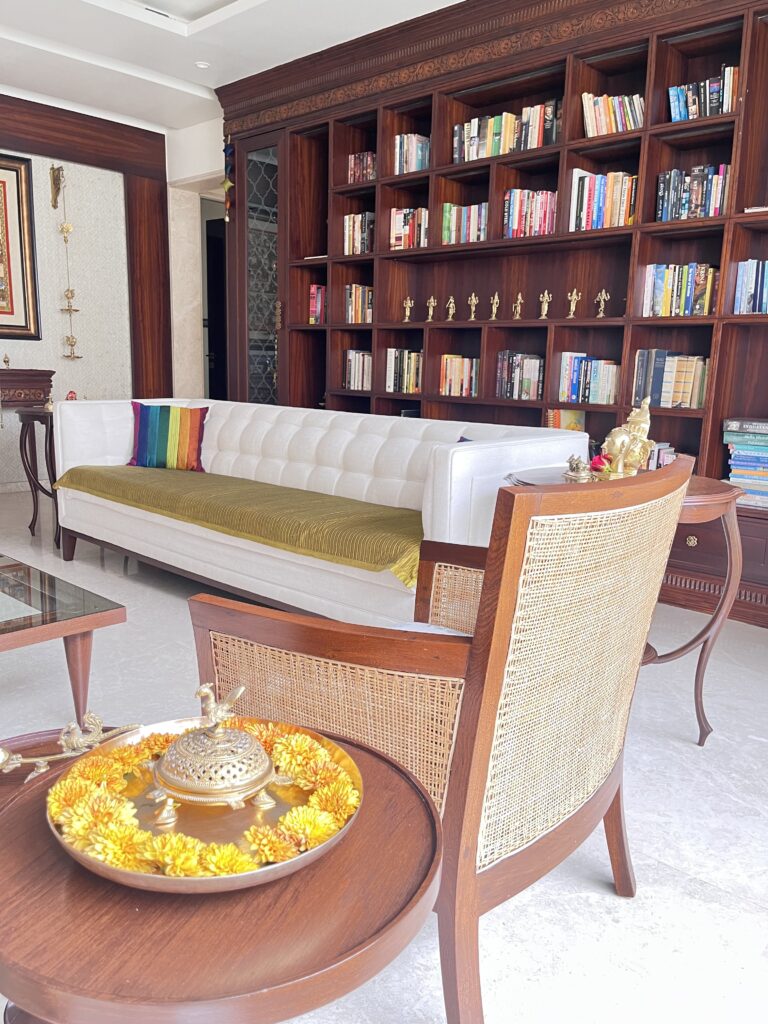 Brass parrot dhupdani and urli plate on the table at the living room | Ranjana and Milind's apartment in Pune