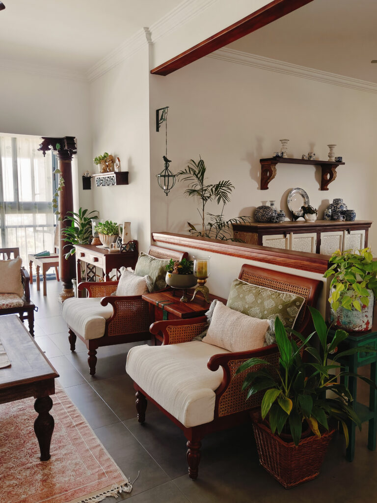 the wall divides the dining area from the living room | Girija home tour in Kochi