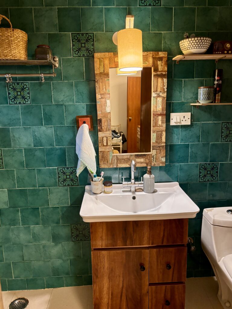 Home tour of Supreet in South Delhi | The bathroom has a huge wash basin with a cabinet and anti-skid floor tiles