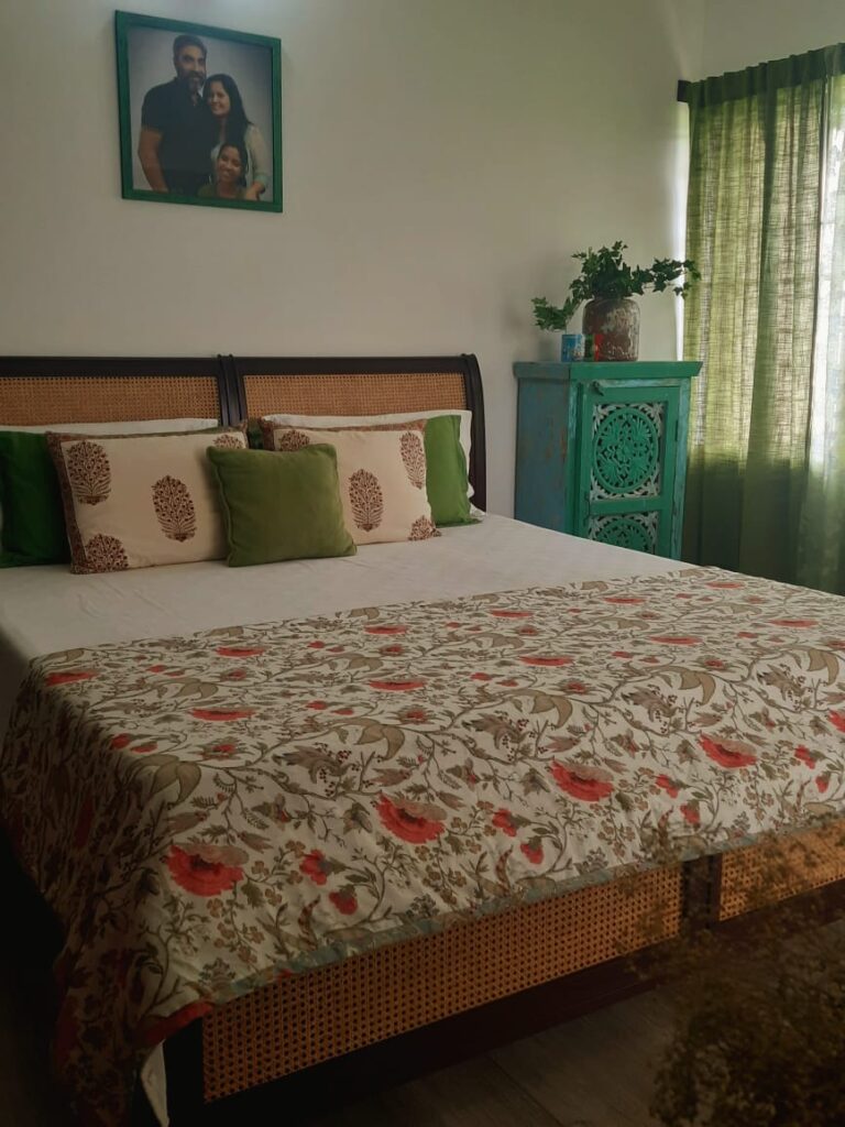 The colour theme carries forward to the master bedroom | Girija home tour in Kochi